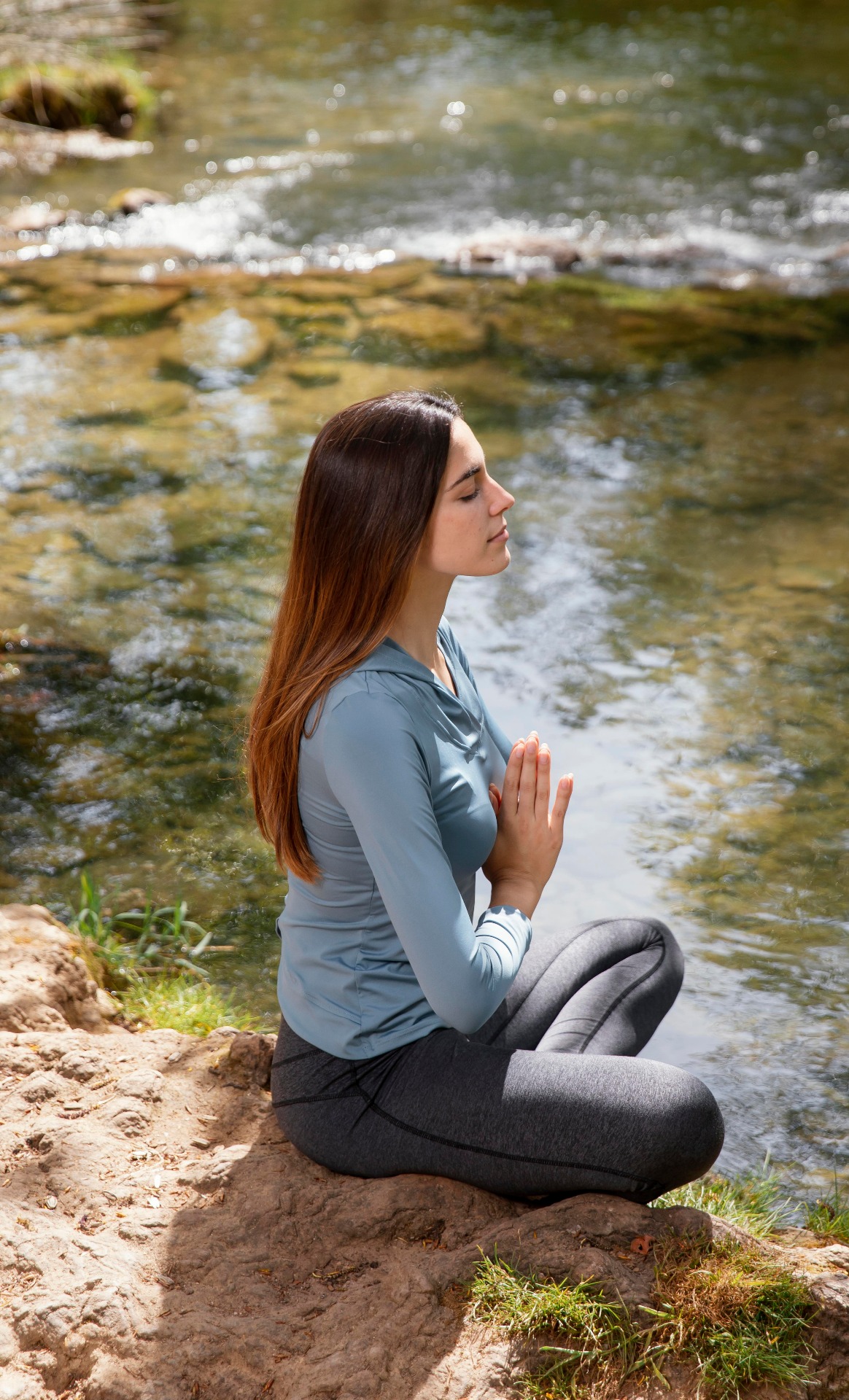 Mindful meditation by the water: breathing in calm, breathing out stress