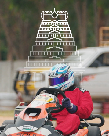 Go-Kart driver in racing gear and helmet driving a kart with a sketch of a temple structure above.