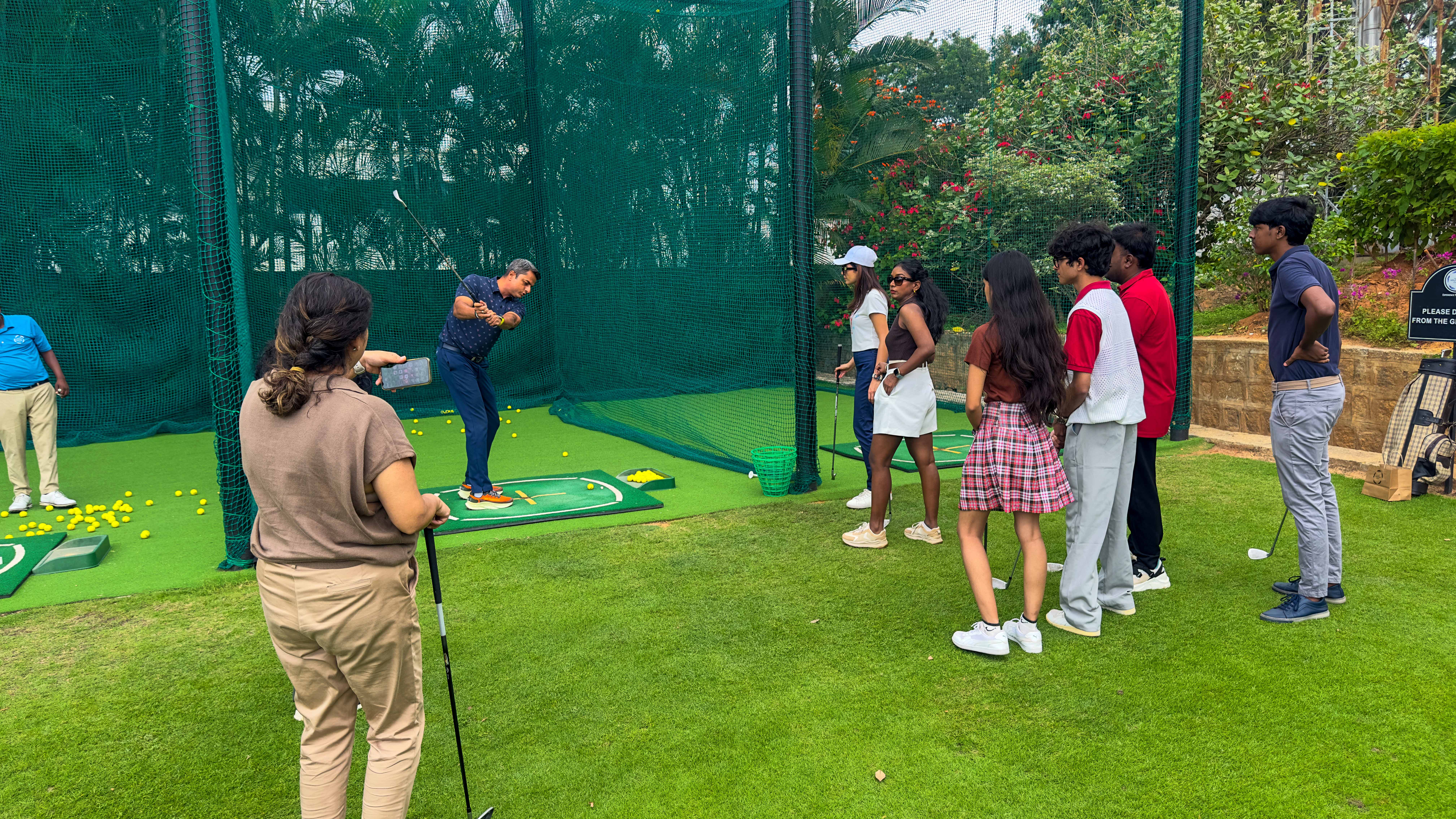 Practice the swings at the nets before a fun putting competition with other participants