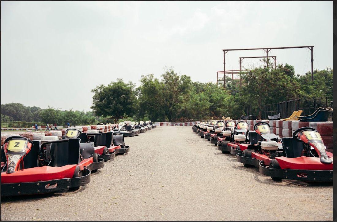 Rows of numbered go-karts lined up on the track ready for Hyderabad Go-Karting Level 2 Training.