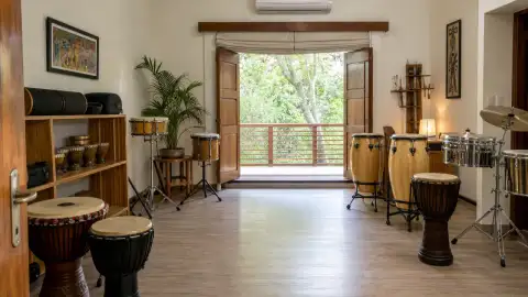 Standalone gallery: Show the unoccupied music space ready for rhythm practice, with drums arranged.